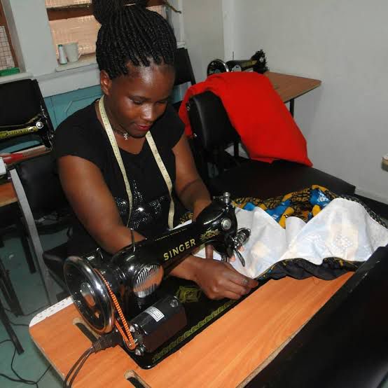 Students working on fashion design projects